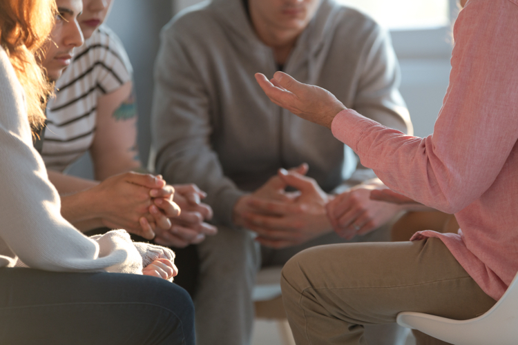 A group of people sat talking