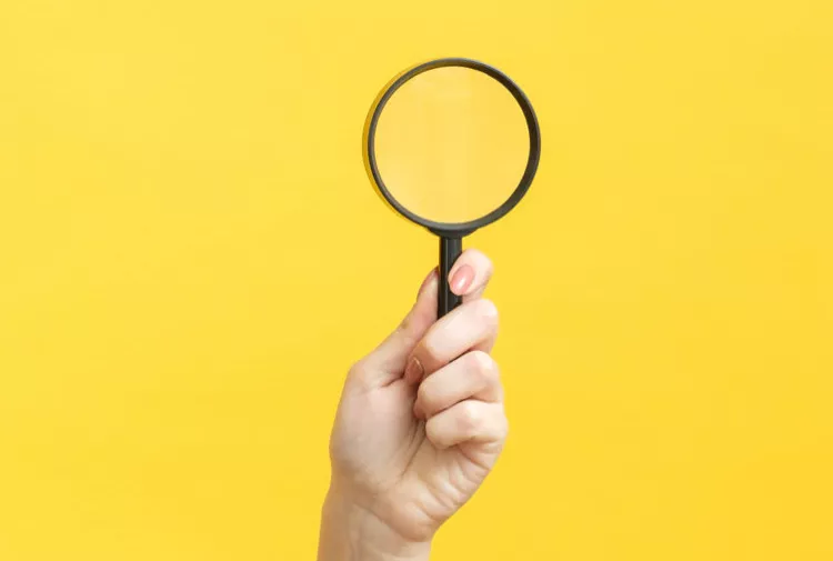 A magnifying glass to illustrate healthcare fieldwork services recruitment